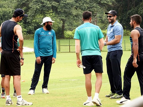 Former Indian allrounder Ifran Pathan (second right), coach of Jammu & Kashmir cricket team, shares a light moment with the boys.
