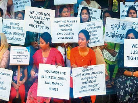 The 350 owners of five apartment buildings in Maradu that are marked for demolition held a protest fast in front of the municipality.