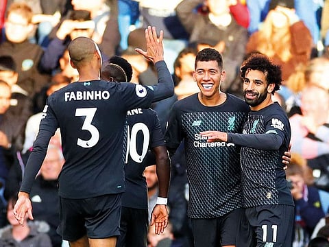 Liverpool’s Roberto Firmino (centre) celebrates scoring the third goal, with teammates Mohammad Salah (right), Sadio Mane (second left) and Fabinho during their match against Burnley at Turf Moor in Burnley late last month.