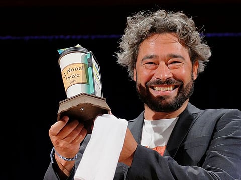 Silvano Gallus of Italy accepts the Ig Nobel Prize in Medicine for the study "Does Pizza Protect Against Cancer?" at the 29th First Annual Ig Nobel Prize Ceremony at Harvard University in Cambridge, Massachusetts, U.S.