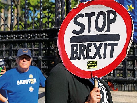 Anti-Brexit protesters demonstrate outside the Houses of Parliament in London.