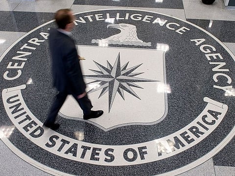 n this file photo taken on August 13, 2008 a man walks over the seal of the Central Intelligence Agency (CIA) in the lobby of CIA Headquarters in Langley, Virginia, on August 14, 2008.