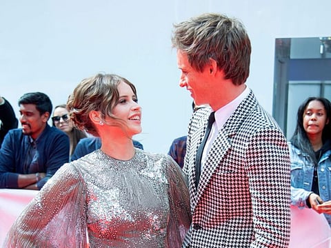 Actors Felicity Jones (L) and Eddie Redmayne attend 'The Aeronauts' premiere at the Roy Thompson Hall during the 2019 Toronto International Film Festival Day 4 on September 8, 2019, in Toronto, Ontario. / AFP / VALERIE MACON