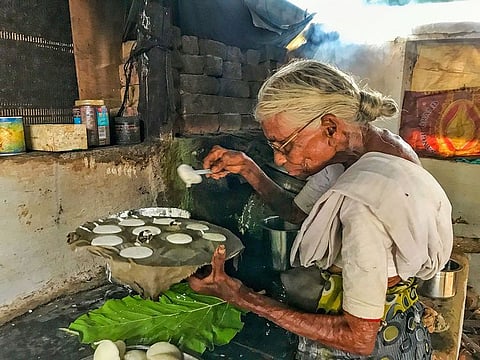 82-year-old Kamalathal prepares idlis, a staple south Indian breakfast delicacy, in Coimbatore, Friday, Sept. 13, 2019.