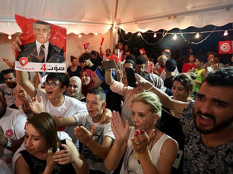 Supporters of detained presidential candidate and Tunisian media mogul Nabil Karoui react after unofficial results of the Tunisian presidential election in Tunis, Tunisia, September 15, 2019.