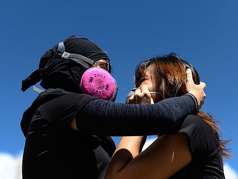 24-year-old Hong Kong woman 'Jane' with her friend in Hong Kong. For weeks, Jane, a pseudonym, lied to her mother about joining Hong Kong's protests.