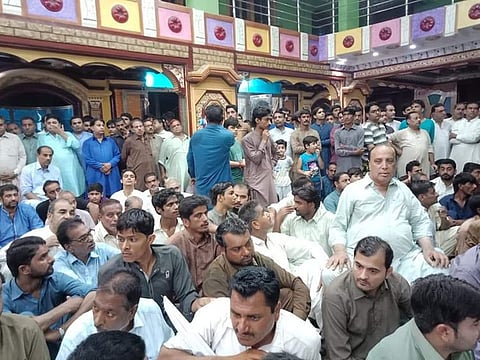 People gather at a temple in Ghotki, Pakistan.