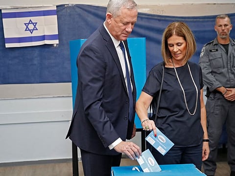 Retired Israeli General Benny Gantz, one of the leaders of the Blue and White political alliance, casts his ballot with his wife Revital. The three-month campaign has focused much more on personalities than issues.