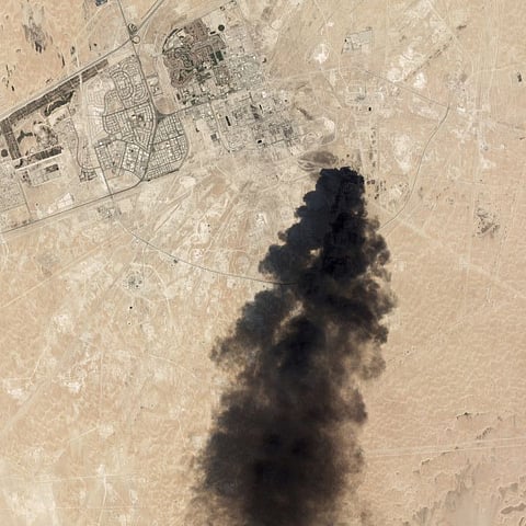 This September 14 satellite image from Planet Labs Inc. shows thick black smoke rising from Aramco's Abqaiq oil processing facility.
