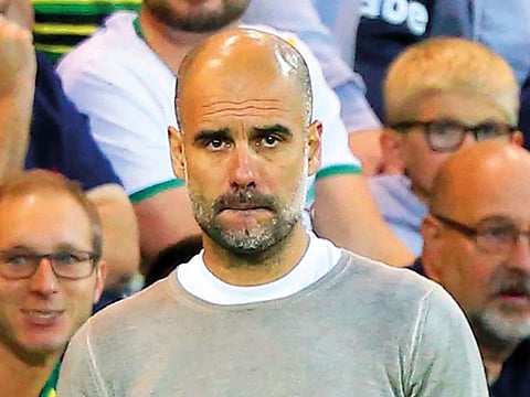 Manchester City's Spanish manager Pep Guardiola gestures on the touchline during the English Premier League football match between Norwich City and Manchester City at Carrow Road in Norwich, eastern England.