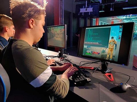 Ryan Chapman and other students starting Staffordshire University’s esports degree course play “Counter-Strike” in the school’s new London digital studio.