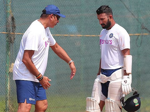 India's Cheteshwar Pujara with coach Ravi Shastri