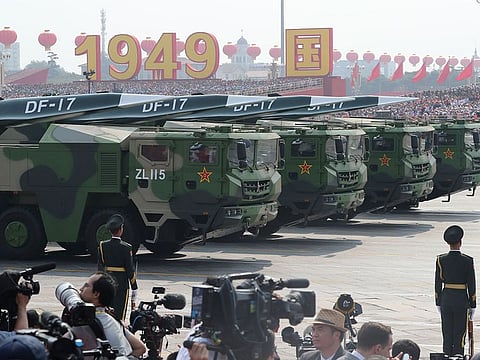 Military vehicles, carrying DF-17, roll down as members of a Chinese military honour guard march during the parade to commemorate the 70th anniversary of the founding of Communist China in Beijing, Tuesday, Oct. 1, 2019.