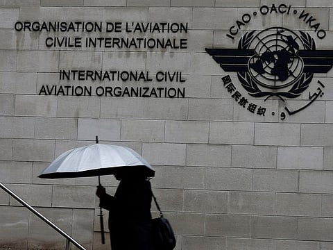 A pedestrian walks past the International Civil Aviation Organization (ICAO) headquarters building in Montreal, Quebec, Canada.