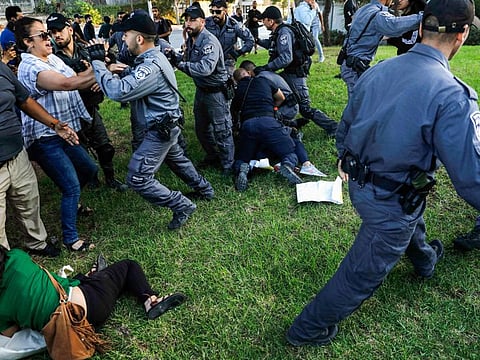 Israeli security forces detain Palestinian activists during a demonstration near the Hadassah Medical Center Mount Scopus in Jerusalem on October 1, 2019