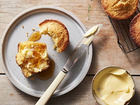 Rich and buttery corn muffins. It may not be as trendy as kouign-amann or Cronuts, but a buttered, toasted corn muffin is a thing of beauty. Food Stylist: Simon Andrews. (Christopher Testani/The New York Times)
