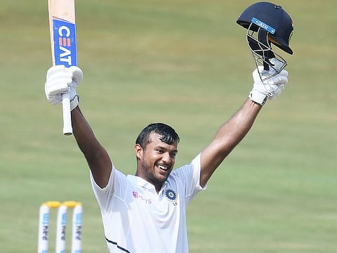 India's Mayank Agarwal celebrates scoring 200 runs during the second day's play of the first Test match against South Africa at the Dr. Y.S. Rajasekhara Reddy ACA-VDCA Cricket Stadium in Visakhapatnam on October 3, 2019.