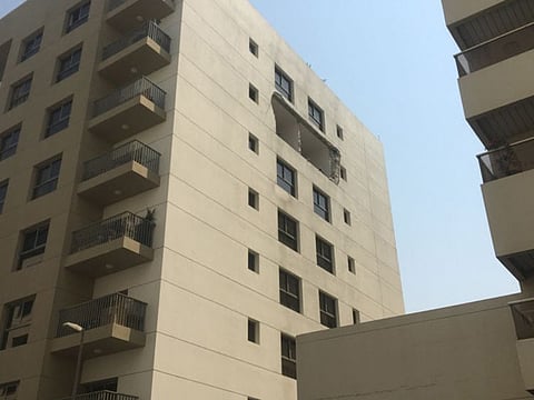 The windows and wall of the sixth floor flat of the building in Bur Dubai were blown out by the blast last Saturday.