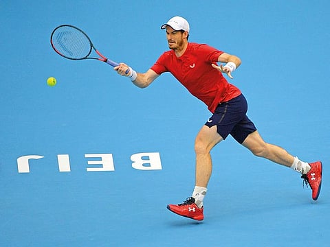 Andy Murray powers a forehand return during his men’s singles quarterfinal match against Dominic Thiem.
