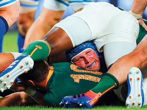 Italy’s hooker Luca Bigi reacts in a ruck during the Japan 2019 Rugby World Cup Pool B match against South Africa.
