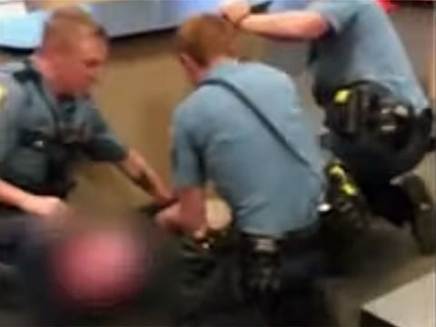 A screengrab of the the video of the arrest of a 13-year-old girl.