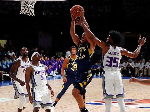 Indiana Pacers player Malcolm Brogdon aims for the net during a match against Sacramento Kings at the NBA India Games 2019 in Mumbai.