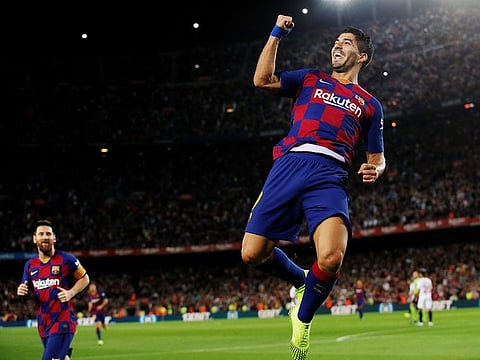Barcelona's Luis Suarez celebrates scoring their first goal.