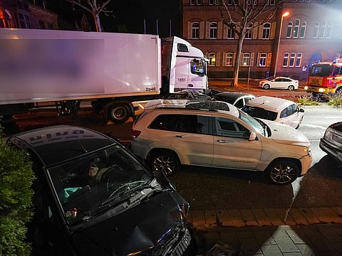 Picture shows the scene where a truck crashed in to cars stopped at a red light in Limburg, western Germany on October 7, 2019.