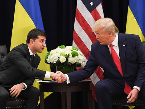 US President Donald Trump and Ukrainian President Volodymyr Zelensky shake hands during a meeting in New York on September 25, 2019.