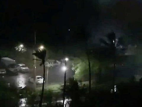 Heavy rain and strong wind brought by super typhoon Hagibis are seen over the US territory of Guam, October 8, 2019, in this still image taken from a social media video.