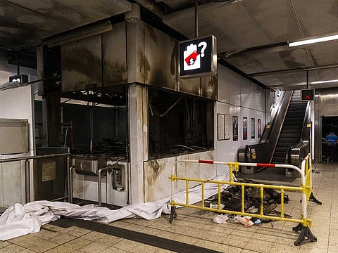 Barriers cordon off debris outside a burned out customer service center during a media tour of the Kwun Tong station, operated by MTR Corp., in Hong Kong, China, on Tuesday, Oct. 8, 2019.