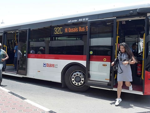 Commuters coming ouit of  RTA bus at the Satwa bus Station in Dubai