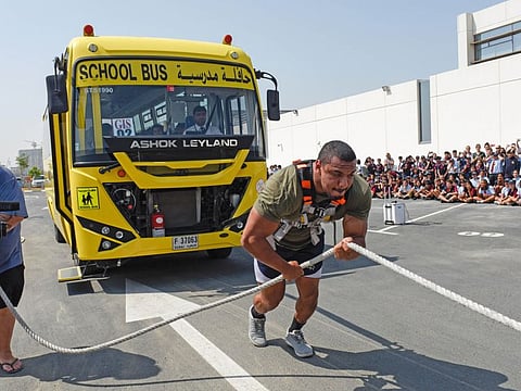 American strongman Larry Williams pulling the school bus filled with kids at GEMS International school in Dubai on Wednesdy 09 October 2019. Photo: Virendra Saklani/Gulf News