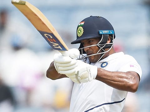 India's Mayank Agarwal plays a shot during the first day of the second Test cricket match against South Africa at Maharashtra Cricket Association Stadium in Pune on October 10, 2019.