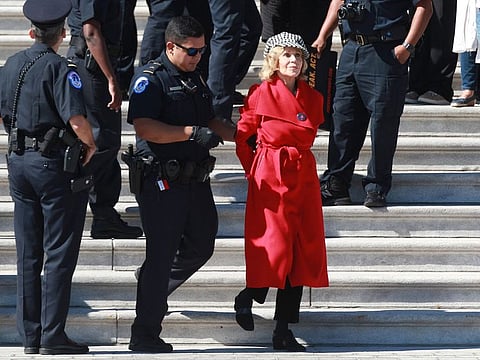 Jane Fonda is arrested and led away at a protestors rally on global climate at the U.S. Capitol on Friday, Oct. 11, 2019