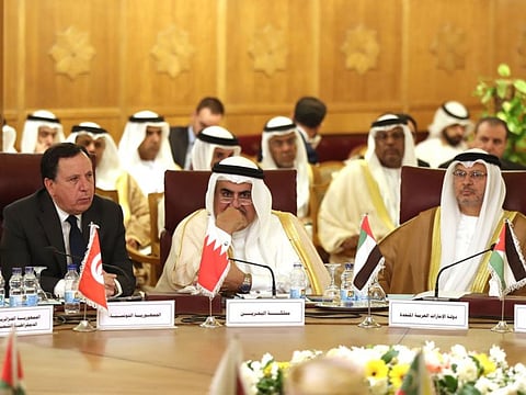 (L to R) Tunisian Foreign Minister Khemaies Jhinaoui, Bahrain Foreign Minister Khalid Ben Ahmed al-Khalifah and Emirati minister of state for foreign affairs Anwar Gargash attend an emergency foreign ministers meeting at the Arab League headquarters in Cairo on October 12, 2019, to discuss Turkey's offensive on Syria.  / AFP / Mohamed el-Shahed