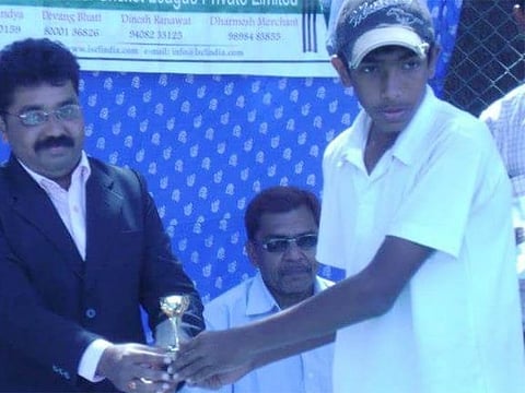 Teenager Jasprit Bumrah taking an award.