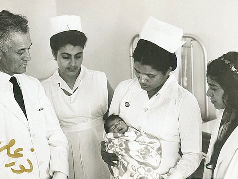 Renowned UAE photographer Noor Ali Rashid took a photo of the first baby born in Kuwait Hospital, Bur Dubai 1967. Atheeja Boussaiba (second from left) was at the hospital training as a nurse.
