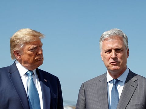 FILE PHOTO: U.S. President Donald Trump listens to his newly announced White House national security adviser Robert O'Brien speak to reporters after he named O'Brien as his fourth national security adviser at Los Angeles International Airport in Los Angeles, California, U.S., September 18, 2019. REUTERS/Tom Brenner/File Photo