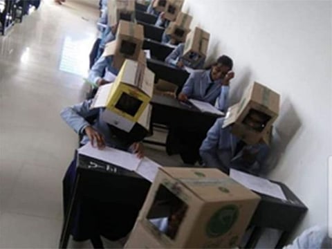 Karnataka students wearing cartons on their heads