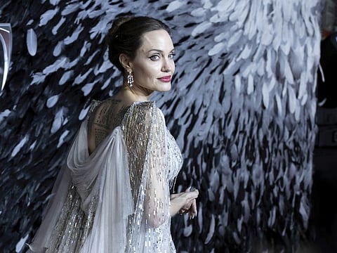 Actress Angelina Jolie poses for photographers on arrival at the European premiere of the film 'Maleficent Mistress of Evil' in central London on Wednesday, Oct. 9, 2019. (Photo by Grant Pollard/Invision/AP)