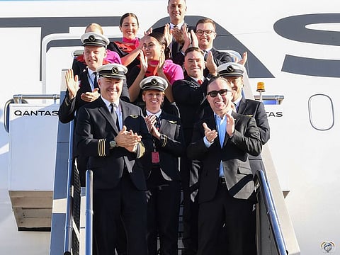 Qantas shows Qantas Group CEO Alan Joyce (Bottom-R) and crew exiting a Qantas Boeing 787 Dreamliner plane after arriving at Sydney international airport after completing a non-stop test flight from New York to Sydney on October 20, 2019.