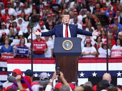 US President Donald Trump speaks during a rally in Dallas, Texas, U.S., on Thursday, Oct. 17, 2019.  In Syria, as in Iraq, President Trump’s policy has not significantly deviated from Obama‘s approach.