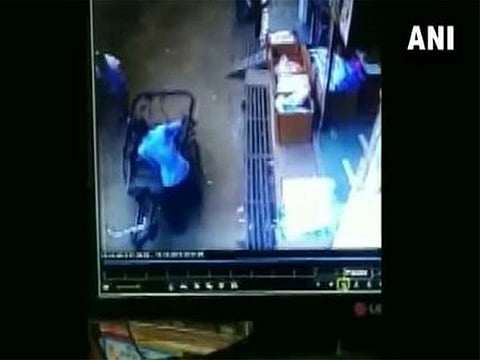 CCTV footage of child falling from a 35 feet high building.
