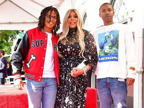 Talk Show Host Wendy Williams, her son Kevin Hunter Jr. (L) and her nephew (R) pose after she was honored with her star on the Hollywood Walk of Fame on October 17, 2019 in Hollywood. / AFP / Frederic J. BROWN