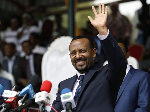 New Ethiopian Prime Minister Abiy Ahmed waves during his rally in Ambo, about 120km west of Addis Ababa, Ethiopia.