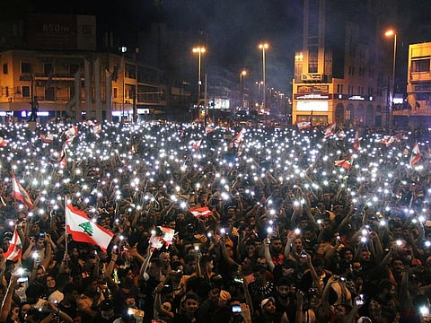 Demonstrators take part in an anti-government protest in Tripoli, Lebanon October 20, 2019.