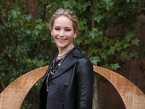 American actress Jennifer Lawrence smiles during a photocall before Dior's Ready To Wear Spring-Summer 2020 collection, unveiled during the fashion week, in Paris, Tuesday, Sept. 24, 2019. (AP Photo/Francois Mori)