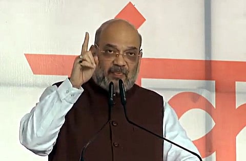 India's Home Minister Amit Shah addresses at an election rally in Nandurbar on Saturday