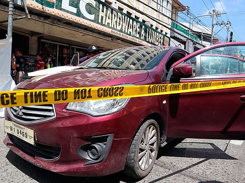 Police check on an Australian named Anthony George inside a car in Olongapo, northern Philippines.